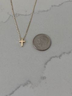 Ensure lasting memories for the special moments in your life with this 14K gold tiny cross necklace, a religious jewelry gift. Crafted for women of Christian faith, this small cross pendant is bold and designed in a 3D mini cross configuration. Free shipping offered. This piece is beautiful, elegant, shiny, and suitably sturdy for a baptismal gift. ⁙ Materials: 14K Yellow Gold⁙ Dimensions: 8MM Height by 6MM Width in diameter, the chain is very sturdy and 1MM wide, it is 16"-18" it can be hooked Small Cross Necklace Gold, Everyday Yellow Gold Cross Charm Necklace, Everyday 14k Gold Cross Pendant Necklace, Daily 14k Gold Cross Pendant Necklace, Everyday 14k Gold Cross Necklace, Minimalist 14k Gold Crucifix Cross Necklace, Dainty 14k Gold Cross Charm Necklace, Tiny Cross Necklace, Cross Necklace Women