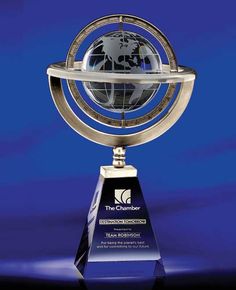 an award is shown with a globe on the top and blue background in the background