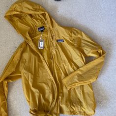 Brand New Packable Wind/Rain Jacket Mens Windbreaker, Wind And Rain, Patagonia Jacket, Patagonia Jackets, Gold Yellow, Patagonia, Rain Jacket, Mens Jackets, Jackets & Coats