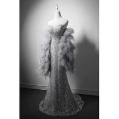 This stunning Grey Beaded Mermaid Formal Dress With Feather Shawl is perfect for any special occasion. The exquisite beading and intricate detailing on the bodice will make you feel like a princess. The full skirt flares out from the waist and is lined with a layer of feathers, creating an elegant and luxurious look. The feather shawl has a soft and textured feel and adds a touch of glamour to the look. The dress is available in plus size and is sure to make you the belle of the ball. Polka Dot Wedding Dress, Feather Shawl, Fashion Documentaries, Feather Prom Dress, Feather Cape, Beaded Mermaid, Dress With Shawl, Glamour Dress, Feather Dress