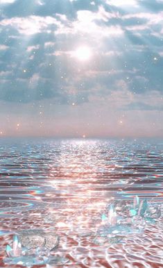 the sun shines brightly through the clouds over water with bubbles floating on top of it