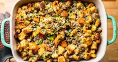 a casserole dish filled with stuffing and vegetables