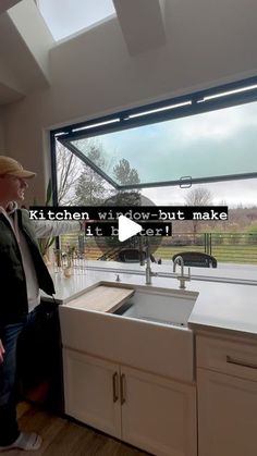 a man standing next to a kitchen sink in front of a window with the words kitchen wide - but make it hard