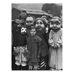 an old black and white photo of children dressed up as creepy people with their faces painted on