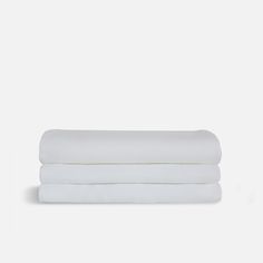 three white sheets stacked on top of each other