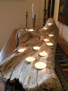 a wooden table with candles on it