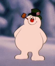 a snowman with a green hat and red nose standing in front of a blurry background