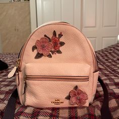 Brand New Mini Backpack. Super Cute Color With 3d Floral Embroidery. Perfect For Running Errands. Leave Questions Down Below! Designer Pink Leather Backpack, Floral Embroidered Backpack For Daily Use, Floral Embroidery Backpack For Everyday Use, Designer Pink Standard Backpack, Everyday Floral Embroidery Backpack, Pink Bags With Embroidered Logo For Daily Use, Pink Floral Embroidered Travel Bag, Coach Sling, Coach Backpack