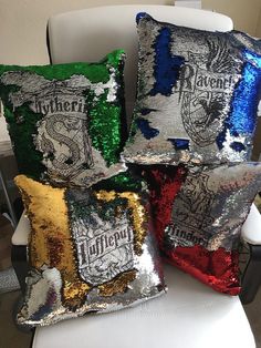 four harry potter sequin pillows on a white chair