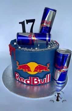 a cake made to look like a red bull birthday cake with cans on the side