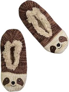 pair of slippers with slotty faces on them