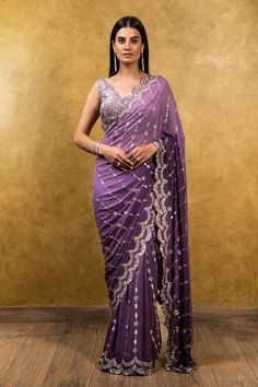 Editor's Note Mauve Georgette Saree Blouse With Antique Sequins & Dabka Embroidery Color: Mauve Fabric: Georgette Care: Dry Clean Only About the Designer Nitika Gujral’s journey with de... Mauve Saree, Georgette Saree Blouse, Plunging Neckline Blouse, Dabka Embroidery, Latest Sarees Online, Mauve Fabric, Georgette Saree With Blouse, Designing Clothes, Purple Saree