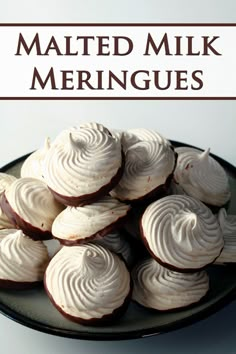 a plate filled with meringues on top of a table