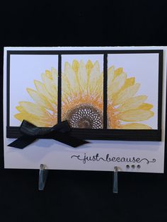 a card with a sunflower painted on it