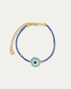 Embrace the protective and stylish energy of the Solana Evil Eye Blue Beaded Bracelet. This charming bracelet showcases a captivating evil eye charm surrounded by beautiful blue beads. The evil eye symbol is believed to ward off negativity and bring good fortune, making this bracelet not only a stack favourite but also Evil Eye Jewellery, Evil Eye Blue, Charming Bracelet, Evil Eye Symbol, Negative Vibes, Handmade Evil Eye, Evil Eye Design, Eye Symbol, Blue Beaded Bracelets