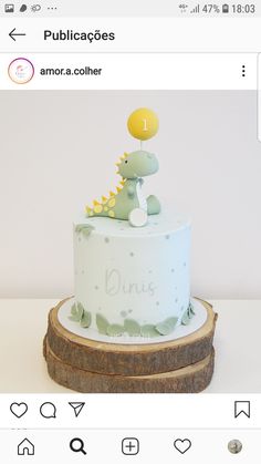 a birthday cake with a dinosaur on top