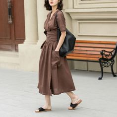 This elegant linen dress exudes a timeless charm with its deep brown hue and minimalist design. The dress falls to a mid-calf length, offering a flowy and comfortable fit that moves with ease. Ideal for both casual outings and more formal events.  DETAIL * 100% Linen * Two side big pockets * V neck dress * Short sleeve linen dress * Plus size dress * Fabric belted Linen dress * Midi length * Perfect for summer, spring * Casual linen dress, plus size linen dress * Wash by hand or machine with col Brown V-neck Solid Color Dress, Brown V-neck Solid Dress, Brown V-neck Dress, Solid Color Linen V-neck Dress, Brown V-neck Solid Color Maxi Dress, Chic Brown Linen Dress For Spring, Solid V-neck Linen Dress, Linen V-neck Midi Dress, Casual Brown Linen Midi Dress