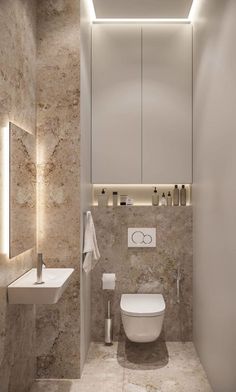 a bathroom with a toilet, sink and mirror on the wall next to each other