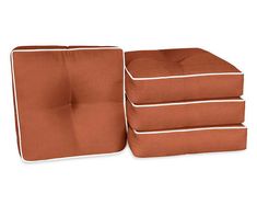 four square cushions stacked on top of each other