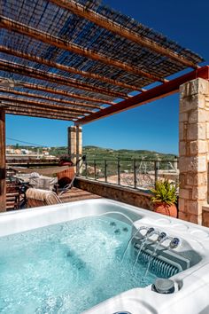 an outdoor jacuzzi on the roof of a house