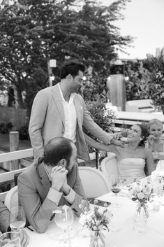 a group of people sitting around a table