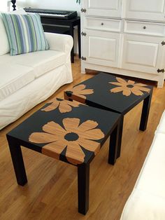 two tables sitting on top of a hard wood floor