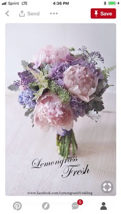 a bouquet of flowers sitting on top of a wooden table