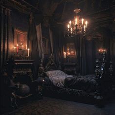 an ornate bedroom with chandelier, bed and fireplace in the corner is lit by candles