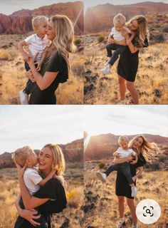 a woman holding a baby in her arms while standing on top of a desert field