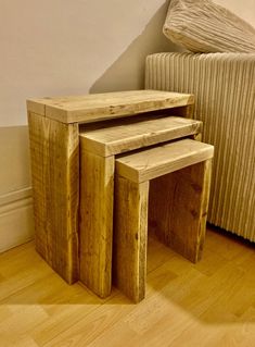 three wooden tables sitting on top of a hard wood floor