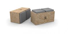 two cubes made out of wood and concrete with the letter g on them, sitting next to each other