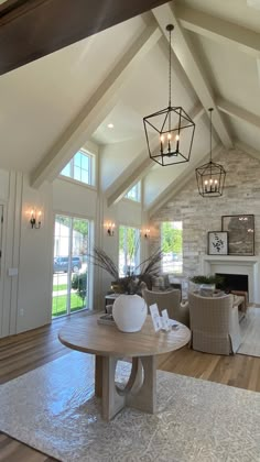 a living room filled with furniture and a fire place in the middle of a room