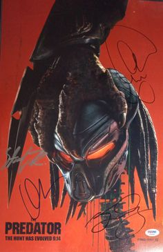 an autographed poster for the predator movie