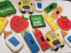 decorated cookies with school related items displayed on table