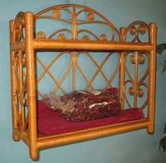 a bamboo shelf with a red towel on it