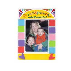 an image of a woman and two children in front of a frame with the words grand parents on it