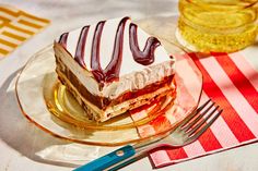 a piece of cake sitting on top of a plate next to a knife and fork