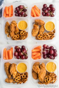 six plastic containers filled with chicken, pretzels, grapes, carrots and crackers