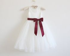 The dress color is light ivory, not white, not yellowish. Please make sure the dress color before ordering. The listing below is white dress, please see the differences. https://www.etsy.com/listing/475159757/white-flower-girl-dress-baby-girls-dress Shipping: We ship the dress by standard shipping(YunExpress), express shipping(Fedex). If you need the dress within one month, please choose upgrade shipping. Please read our shop policies before placing order. https://www.etsy.com/shop/AlexDress/pol Fitted White Tutu Dress For Confirmation, White Fitted Tutu Dress For Confirmation, White Princess Dress With Lace Bodice For Dress-up, Burgundy Flower Girl Dress, Ivory Flower Girl Dress, Burgundy Ribbon, Lace Flower Girl Dress, Bear Wedding