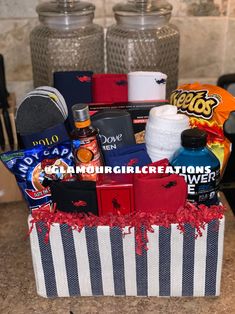 a gift basket filled with various items on top of a counter