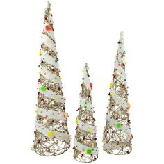 three white christmas trees with colorful ornaments on them and one is made out of wire