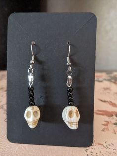 Skull beads on stainless steel french wire. Will include rubber backing. Adjustable Black Skull-shaped Earrings, Adjustable Black Skull Earrings, Casual Skull Jewelry For Halloween, Casual Skull-shaped Jewelry Gift, Casual Skull-shaped Jewelry For Gifts, Casual Skull Jewelry For Gifts, Casual Skull-shaped Gift Jewelry, Casual Halloween Skull Jewelry, Handmade Casual Halloween Jewelry