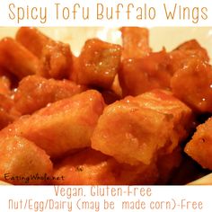 a plate full of food with the words spicy tofu buffalo wings