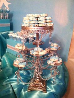 a cake stand with many cupcakes on it