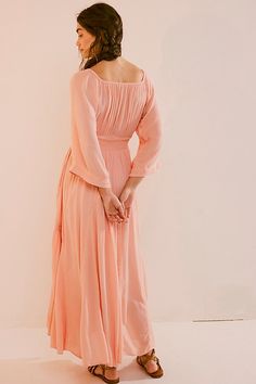 Romantic and ethereal, this sweet maxi from our free-est collection is a true versatile staple. **Fit:** Billowy throughout with cinched waist **Features:** V-neckline, smocked paneling at bodice, exaggerated sleeves, embroidered lace piecing at the skirt **Why We ❤ It:** Timeless with a sleek heel or laid back with simple flats, this style has endless ways to wear. | Dixie Maxi Dress by free-est at Free People in Pink, Size: S Feminine Floor-length Ruched Maxi Dress, Feminine Smocked Bodice Maxi Dress, Feminine Ruched Floor-length Maxi Dress, Ruched Flowy Maxi Dress For Brunch, Flowy Maxi Dress With Gathered Waist, Flowy Maxi Dress With Gathered Waist For Brunch, Elegant Pink Maxi Dress With Smocked Back, Feminine Ruched Maxi Dress For Brunch, Feminine Maxi Dress With Smocked Back