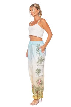 This cropped top features a smocked back for a flexible fit, while delicate ruffle details add a playful touch. Slips on Fixed elastic straps 100% cotton Hand wash cold Cropped Ruffle Crop Top For Beach, Blue Ruffled Crop Top For The Beach, Beach Crop Top Cami With Ruffles, Relaxed Fit Tie-dye Washed Tops, V-neck Ruffled Camisole For Beach, Ruffled Crop Top, White Crop Top, Cropped Top, Full Length