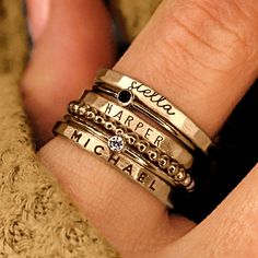 Personalized stackable ring set, engraved with names, dates, or special words. All 6 rings shown in the photos are included in this listing.  Choose between mixed metals, fine silver, or 14K yellow gold-filled for your set! MIXED METALS include: 2 - yellow gold-filled name rings 1 - fine silver name ring 2- sterling silver birthstone rings 1 - yellow gold-filled beaded ring This ring set includes three name rings, a beaded ring, and two cz rings Metal: 14k gold filled, .999 fine silver, .925 ste Stackable Mothers Rings Names, Mothers Ring Two, Affordable Personalized Stackable Rings For Anniversary, Affordable Everyday Stackable Rings With Simple Design, Luxury Engraved Stackable Promise Ring, Cheap Stackable Sterling Silver Rose Gold Rings, Cheap Customizable Rings For Women, Cheap Engraved Stackable Rings For Wedding, Cheap Women's Sterling Silver Stackable Rings