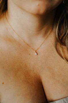 Our Tiny Teardrop Necklace is a gorgeous addition to your everyday look. The sparkling tiny teardrop charm hangs from our long-lasting 14K gold filled or Sterling silver chain. This is the perfect gift for a friend (or yourself) as it is so dainty and ready for everyday wear. You really can't go wrong!FEATURES Tiny teardrop Cubic Zirconia charm 14K gold filled or Sterling silver chain Model is wearing 16" length All necklace findings (clasp, jump rings, tag) & chain are 14K gold filled/Sterling Tiny Gold Necklace, Dainty Gold Jewelry, Dainty Gold Necklace, Gift For A Friend, Chain Extenders, Everyday Necklace, Bohemian Necklace, Teardrop Necklace, Charm Set