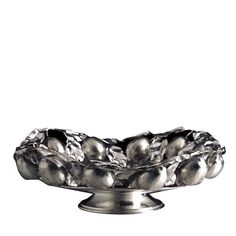 a metal bowl filled with lots of silver fruit