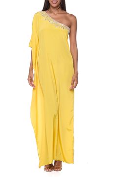 An asymmetrical one-shoulder neckline covered in gleaming embellishments bring eye-catching shine to a flowy cover-up dress. One-shoulder neck Sleeveless 100% polyester Hand wash, dry flat Imported Glamorous Draped One-shoulder Dress, Yellow Off-shoulder Maxi Dress For Party, Glamorous One-shoulder Maxi Dress For Spring, Glamorous One-shoulder Spring Maxi Dress, Asymmetrical Sequin Dress For Summer, Asymmetrical Sequin Summer Dress, Summer Asymmetrical Sequin Dress, Glamorous Draped Summer Dresses, Draped One Shoulder Top For Spring Evening